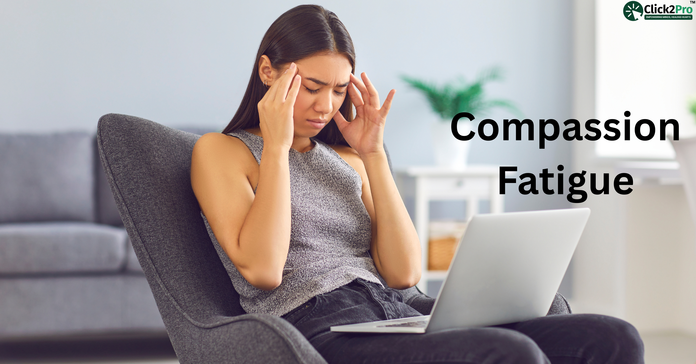Stressed woman experiencing compassion fatigue while working on laptop at home