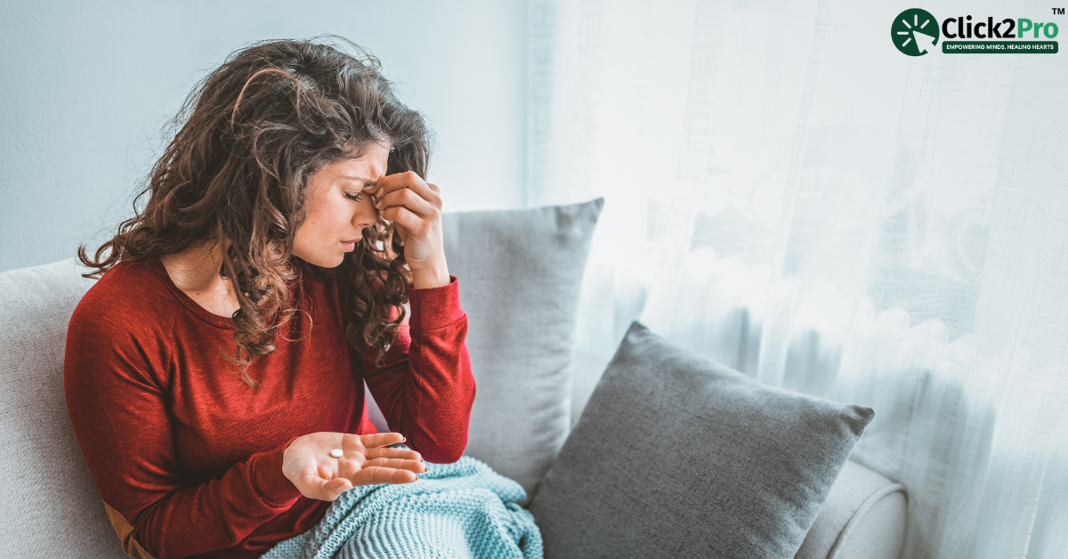 Woman holding her head in pain, reflecting emotional stress and physical discomfort from heartbreak.