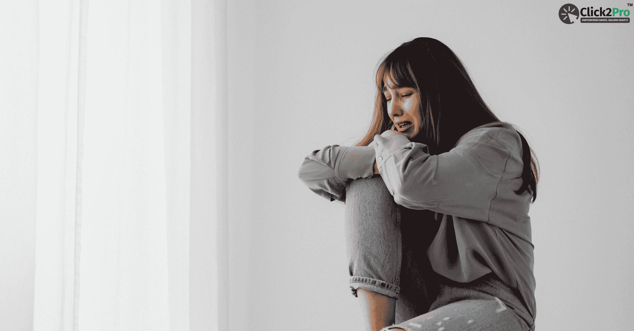 Woman experiencing deep grief and emotional pain, seeking mental health support from Click2Pro.