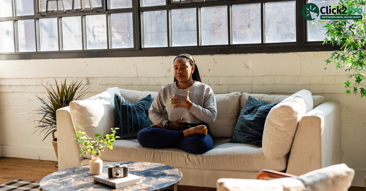 Person practicing mindfulness meditation indoors to alleviate eye strain and support mental well-being.