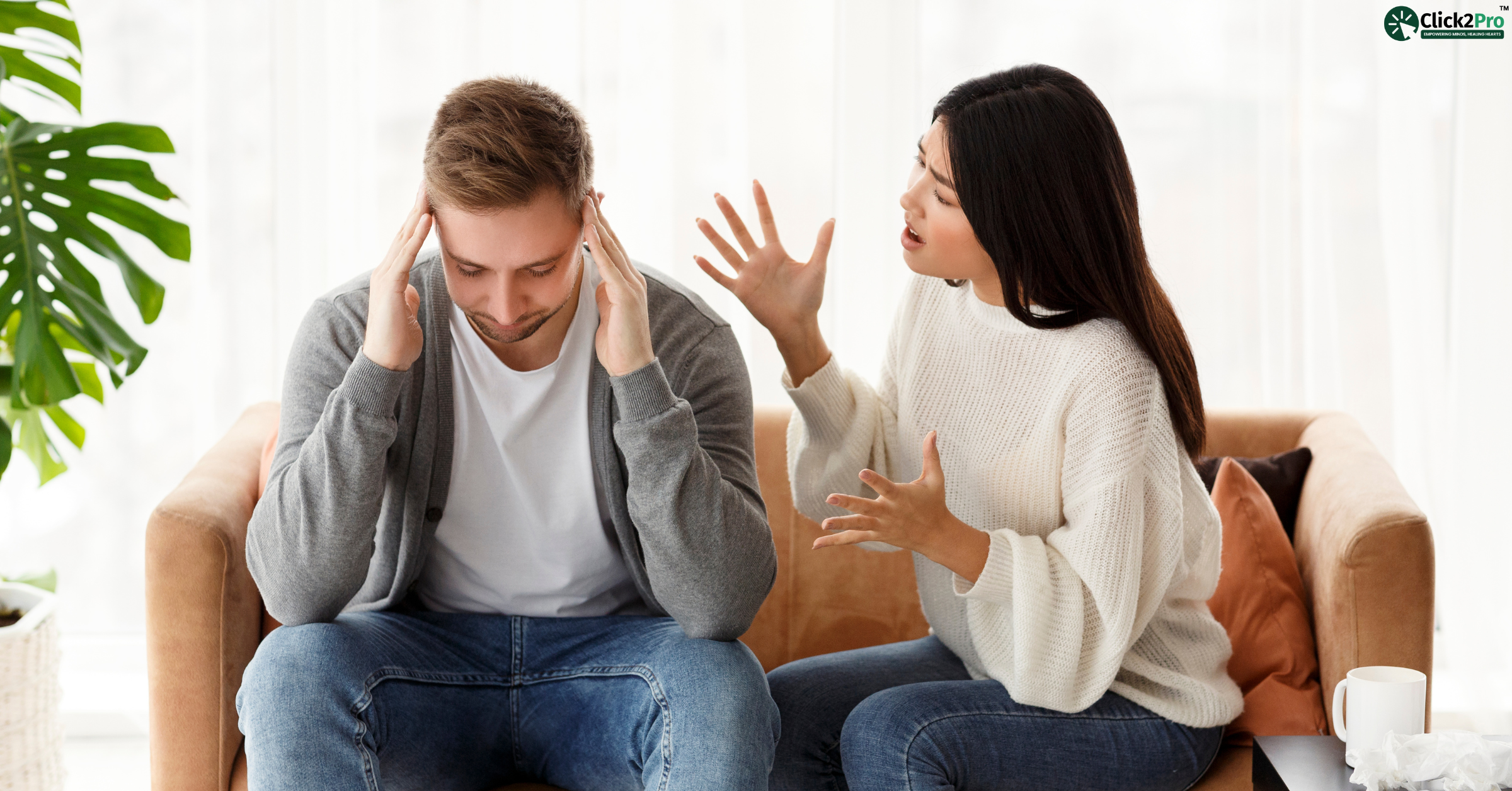 Man distressed while woman yells, depicting emotional abuse and Stockholm Syndrome in relationships.