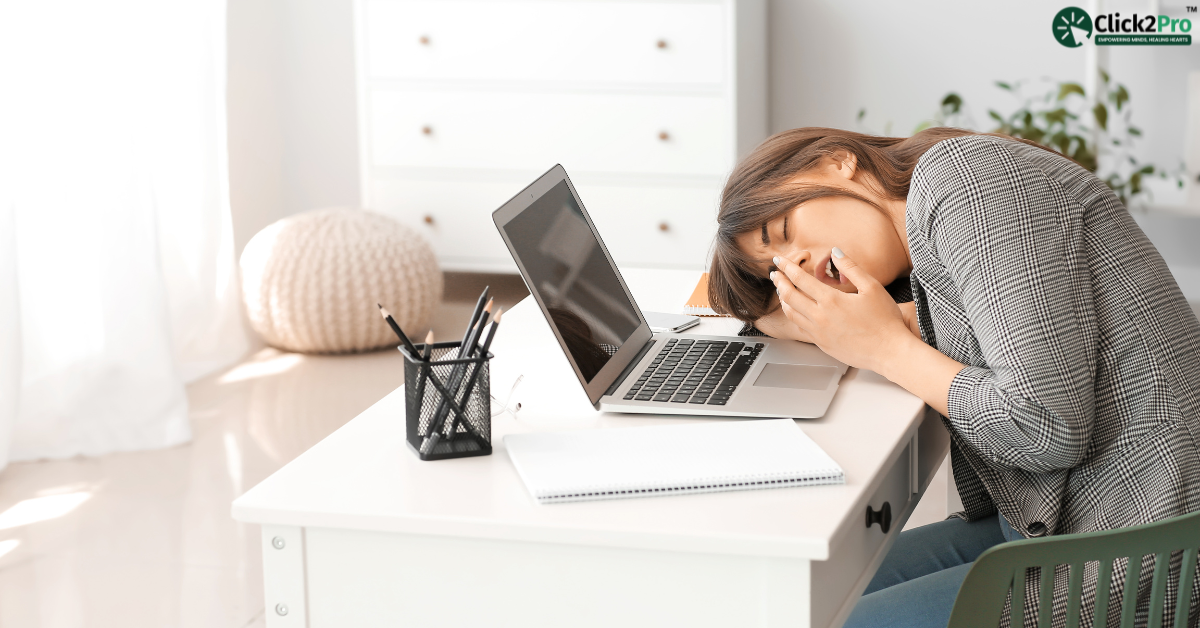 Teen experiencing fatigue at desk due to sleep deprivation, highlighting the mental health impact.