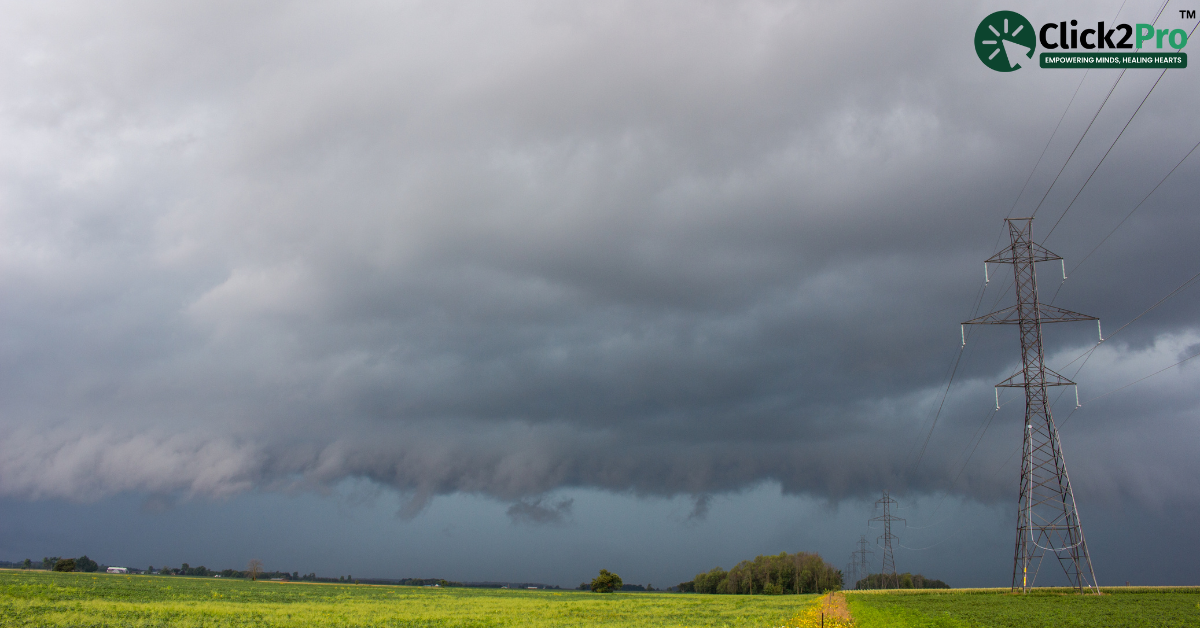 Dark storm clouds over a rural landscape with power lines, symbolizing the emotional impact of repeated storms.