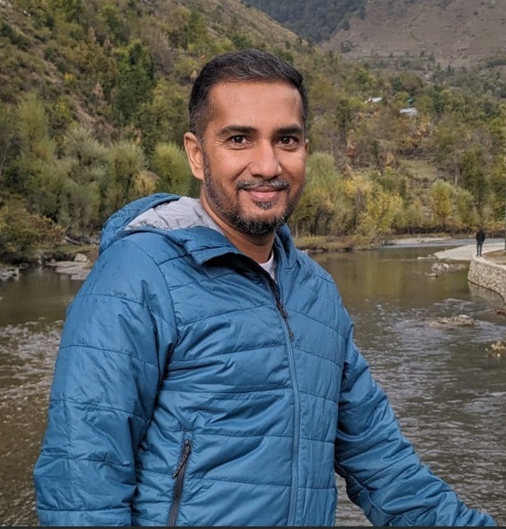 Click2Pro co-founder Amit Gupta standing outdoors in a blue jacket