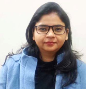 Experienced psychologist in blue sweater providing online therapy at Click2Pro