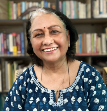 Senior female psychologist with a warm smile offering mental health support at Click2Pro