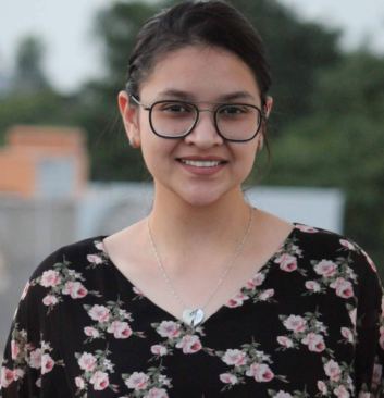 Young female psychologist with glasses specializing in adolescent therapy at Click2Pro