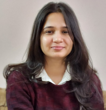 Female psychologist in maroon sweater offering personalized online therapy at Click2Pro