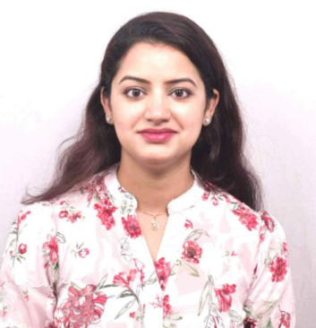 Smiling female psychologist in floral top providing compassionate care at Click2Pro